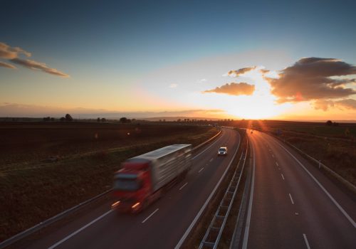 highway-traffic-motion-blurred-truck-on-a-highwa-2024-12-04-16-29-11-utc-min